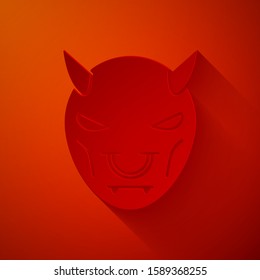 Paper cut Mask of the devil with horns icon isolated on red background. Paper art style. Vector Illustration