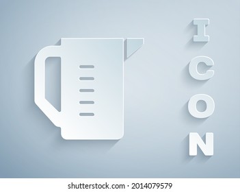 Paper cut Measuring cup to measure dry and liquid food icon isolated on grey background. Plastic graduated beaker with handle. Paper art style. Vector