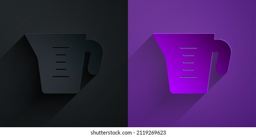 Paper cut Measuring cup to measure dry and liquid food icon isolated on black on purple background. Plastic graduated beaker with handle. Paper art style. Vector