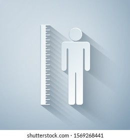 Paper cut Measuring height body icon isolated on grey background. Paper art style. Vector Illustration