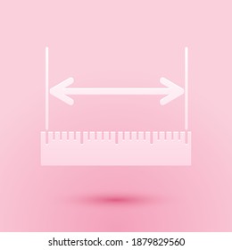 Paper cut The measuring height and length icon isolated on pink background. Ruler, straightedge, scale symbol. Paper art style. Vector.
