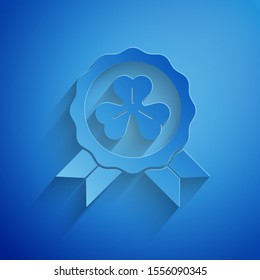 Paper cut Medal with four leaf clover icon isolated on blue background. Happy Saint Patrick day. Paper art style. Vector Illustration