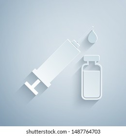 Paper cut Medical syringe with needle and vial or ampoule icon isolated on grey background. Vaccination, injection, vaccine, insulin concept. Paper art style. Vector Illustration