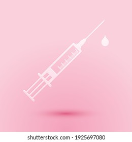 Paper cut Medical syringe with needle and drop icon isolated on pink background. Syringe sign for vaccine, vaccination, injection, flu shot. Paper art style. Vector