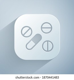 Paper cut Medicine pill or tablet icon isolated on grey background. Capsule pill and drug sign. Pharmacy design. Paper art style. Vector