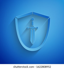 Paper cut Medieval shield with sword icon isolated on blue background. Paper art style. Vector Illustration