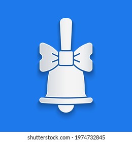 Paper cut Merry Christmas ringing bell icon isolated on blue background. Alarm symbol, service bell, handbell sign, notification. Paper art style. Vector