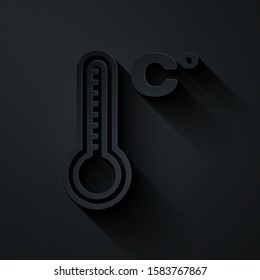 Paper cut Meteorology thermometer measuring heat and cold icon isolated on black background. Temperature Celsius. Paper art style. Vector Illustration