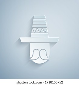 Paper cut Mexican man wearing sombrero icon isolated on grey background. Hispanic man with a mustache. Paper art style. Vector.