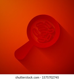 Paper cut Microorganisms under magnifier icon isolated on red background. Bacteria and germs, cell cancer, microbe, virus, fungi. Paper art style. Vector Illustration