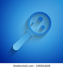 Paper cut Microorganisms under magnifier icon isolated on blue background. Bacteria and germs, cell cancer, microbe, virus, fungi. Paper art style. Vector Illustration