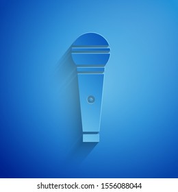 Paper cut Microphone icon isolated on blue background. On air radio mic microphone. Speaker sign. Paper art style. Vector Illustration