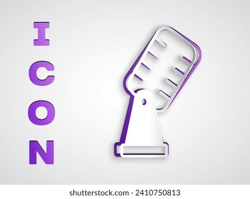 Paper cut Microphone icon isolated on grey background. On air radio mic microphone. Speaker sign. Paper art style. Vector