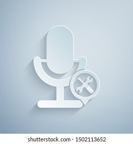 Paper cut Microphone with screwdriver and wrench icon isolated on grey background. Adjusting, service, setting, maintenance, repair, fixing. Paper art style. Vector Illustration