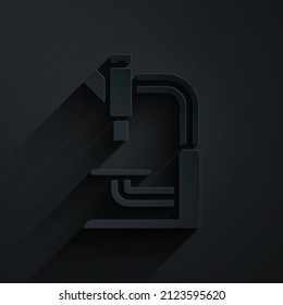 Paper cut Microscope icon isolated on black background. Chemistry, pharmaceutical instrument, microbiology magnifying tool. Paper art style. Vector