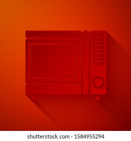 Paper cut Microwave oven icon isolated on red background. Home appliances icon. Paper art style. Vector Illustration