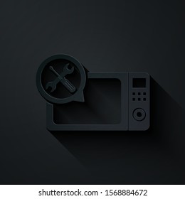 Paper cut Microwave oven with screwdriver and wrench icon isolated on black background. Adjusting, service, setting, maintenance, repair, fixing. Paper art style. Vector Illustration