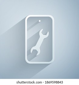 Paper cut Mobile phone with wrench icon isolated on grey background. Adjusting, service, setting, maintenance, repair. Paper art style. Vector