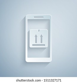 Paper cut Mobile smart phone with app delivery tracking icon isolated on grey background. Parcel tracking. Paper art style. Vector Illustration