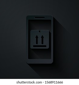 Paper cut Mobile smart phone with app delivery tracking icon isolated on black background. Parcel tracking. Paper art style. Vector Illustration