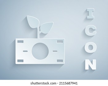 Paper cut Money plant in the pot icon isolated on grey background. Business investment growth concept. Money savings and investment. Paper art style. Vector