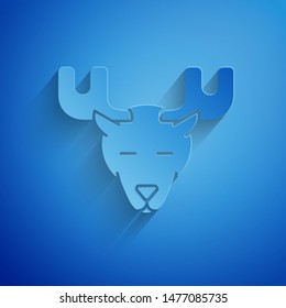 Paper cut Moose head with horns icon isolated on blue background. Paper art style. Vector Illustration