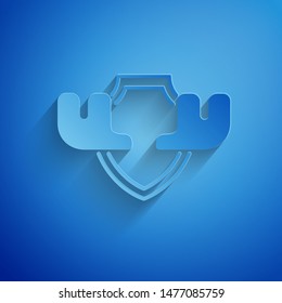 Paper cut Moose horns on shield icon isolated on blue background. Hunting trophy on wall. Paper art style. Vector Illustration