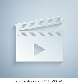 Paper cut Movie clapper icon isolated on grey background. Film clapper board. Clapperboard sign. Cinema production or media industry concept. Paper art style. Vector Illustration