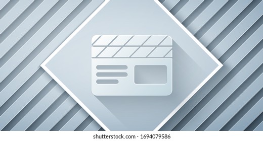 Paper cut Movie clapper icon isolated on grey background. Film clapper board. Clapperboard sign. Cinema production or media industry. Paper art style. Vector Illustration