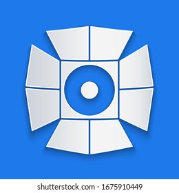Paper cut Movie spotlight icon isolated on blue background. Light Effect. Scene, Studio, Show. Paper art style. Vector Illustration