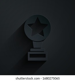 Paper cut Movie trophy icon isolated on black background. Academy award icon. Films and cinema symbol. Paper art style. Vector Illustration