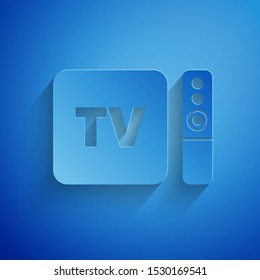 Paper cut Multimedia and TV box receiver and player with remote controller icon isolated on blue background. Paper art style. Vector Illustration