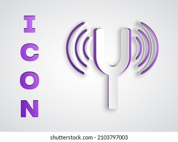 Paper cut Musical tuning fork for tuning musical instruments icon isolated on grey background. Paper art style. Vector