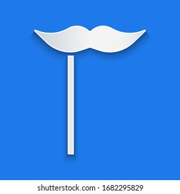 Paper cut Paper mustache on stick icon isolated on blue background. Concept with cardboard carnival mask. Mask for a photo shoot. Paper art style. Vector Illustration