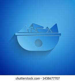 Paper cut Nachos in plate icon isolated on blue background. Tortilla chips or nachos tortillas. Traditional mexican fast food menu. Paper art style. Vector Illustration