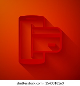 Paper cut NFC Payment icon isolated on red background. Mobile payment. NFC smartphone concept. Transfer icon. Paper art style. Vector Illustration