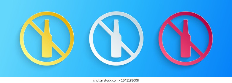 Paper cut No alcohol icon isolated on blue background. Prohibiting alcohol beverages. Forbidden symbol with beer bottle glass. Paper art style. Vector.