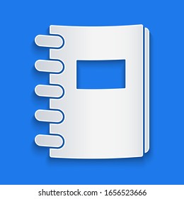Paper cut Notebook icon isolated on blue background. Spiral notepad icon. School notebook. Writing pad. Diary for school. Paper art style. Vector Illustration