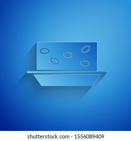 Paper cut Nougat with nuts icon isolated on blue background. Paper art style. Vector Illustration