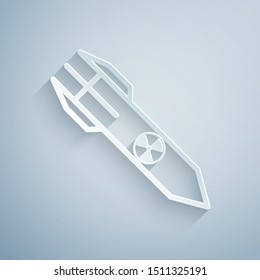 Paper cut Nuclear rocket icon isolated on grey background. Rocket bomb flies down. Paper art style. Vector Illustration