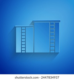 Paper cut Oil and gas industrial factory building icon isolated on blue background. Paper art style. Vector Illustration