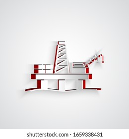 Paper cut Oil platform in the sea icon isolated on grey background. Drilling rig at sea. Oil platform, gas fuel, industry offshore. Paper art style. Vector Illustration