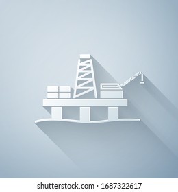Paper cut Oil platform in the sea icon isolated on grey background. Drilling rig at sea. Oil platform, gas fuel, industry offshore. Paper art style. Vector Illustration