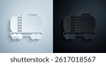 Paper cut Oil railway cistern icon isolated on grey and black background. Train oil tank on railway car. Rail freight. Oil industry. Paper art style. Vector