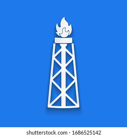 Paper cut Oil rig with fire icon isolated on blue background. Gas tower. Industrial object. Paper art style. Vector Illustration