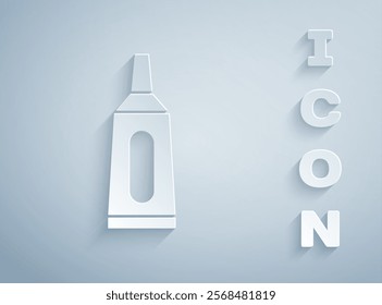 Paper cut Ointment cream tube medicine icon isolated on grey background. Tube, container, toothpaste, cream sign. Paper art style. Vector