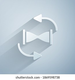 Paper cut Old hourglass with flowing sand icon isolated on grey background. Sand clock sign. Business and time management concept. Paper art style. Vector