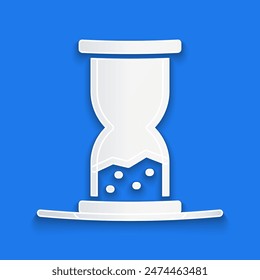 Paper cut Old hourglass with flowing sand icon isolated on blue background. Sand clock sign. Business and time management concept. Paper art style. Vector