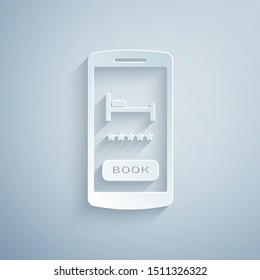 Paper cut Online hotel booking icon isolated on grey background. Online booking design concept for mobile phone. Paper art style. Vector Illustration