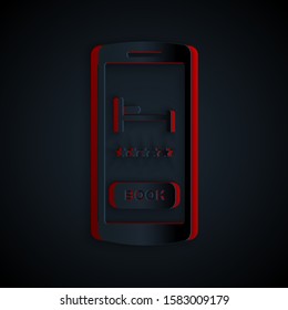 Paper cut Online hotel booking icon isolated on black background. Online booking design concept for mobile phone. Paper art style. Vector Illustration